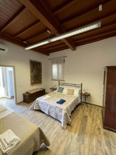 Ένα ή περισσότερα κρεβάτια σε δωμάτιο στο Palazzo Marini