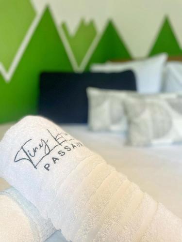 a bandaged foot on top of a bed with at Tiny House Passaúna - Climatizado, deck e parque in Curitiba
