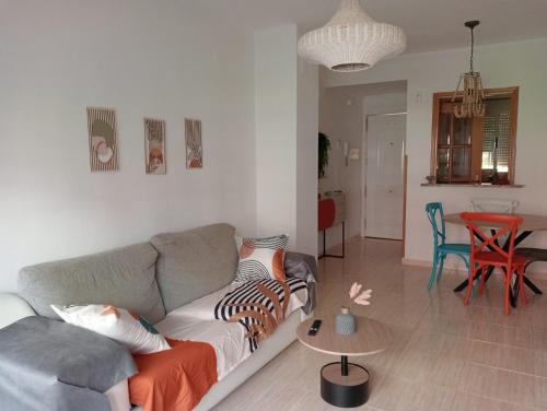 a living room with a couch and a table at Oropesa summer in Oropesa del Mar