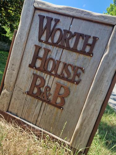 a wooden sign with the words home house bd at Worth House in Wookey