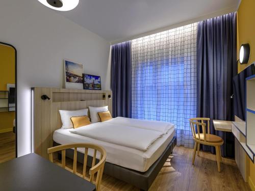 Postel nebo postele na pokoji v ubytování Aparthotel Adagio Access Kiel City