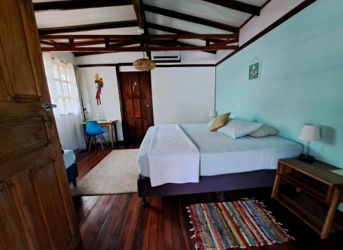 Postel nebo postele na pokoji v ubytování Hotel Tropical