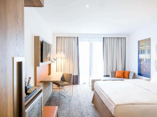 Giường trong phòng chung tại Novotel Nürnberg Centre Ville