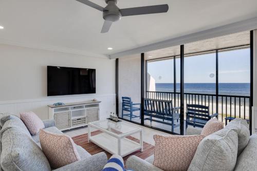 a living room with a view of the ocean at Sundial K402 - Executive Beach View Two Bedroom Penthouse at Sundial Sanibel in Sanibel