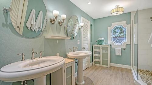 a bathroom with two sinks and a shower at Hemingway House - 117 in Siesta Key