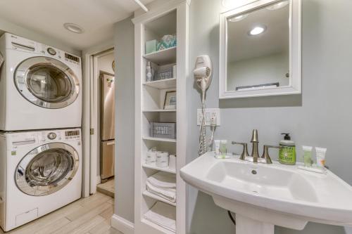 a bathroom with a sink and a washing machine at Cumberland Charm in East End