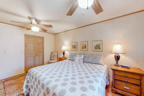 a bedroom with a bed and a ceiling fan at Morris Villa Upper in Lake Junaluska