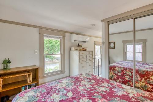 a bedroom with two beds and two windows at A Beautiful Carriage in Lake Junaluska