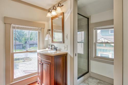 a bathroom with a sink and a mirror at A Beautiful Carriage in Lake Junaluska
