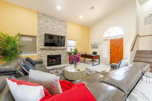 a living room with a couch and a fireplace at Welcome to Luxe Stays in Phoenix