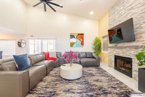 a living room with a couch and a fireplace at Welcome to Luxe Stays in Phoenix