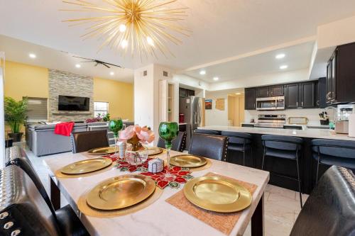 a dining room and kitchen with a table and chairs at Welcome to Luxe Stays in Phoenix