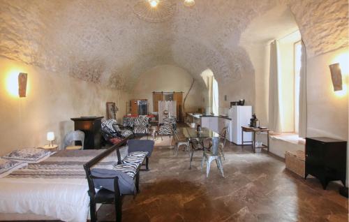 a bedroom with a bed and a table and chairs at Wellness Cathédrale Loft in Viviers