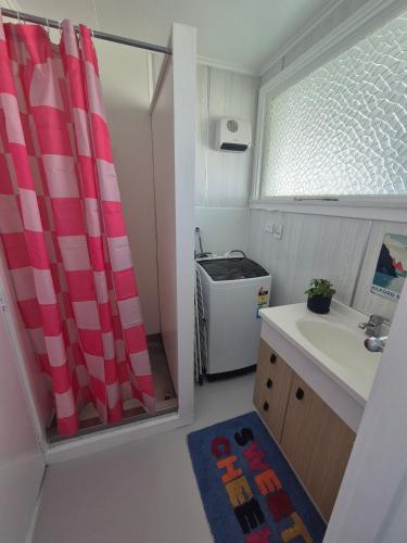 a small kitchen with a sink and a window at McKerrow St - 2 in Te Anau