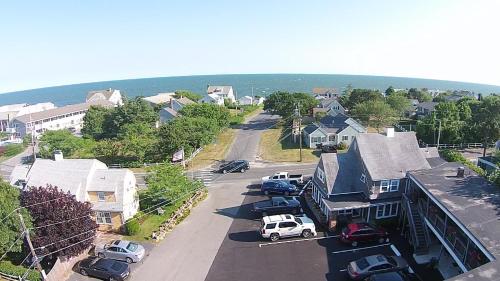 a small town with cars parked in a parking lot at The Cutty Sark in Dennis Port