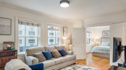 a living room with a couch and a bed at Let's Get Cozy In Seattle! in Seattle