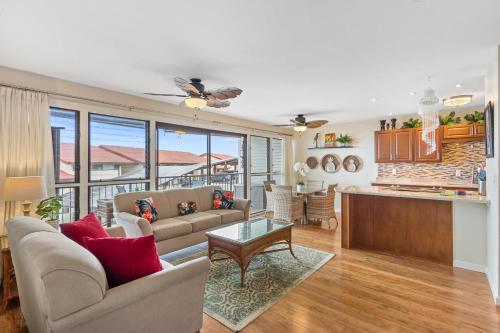 a living room with a couch and a table at Kona Coffee Villas B216 condo in Honalo