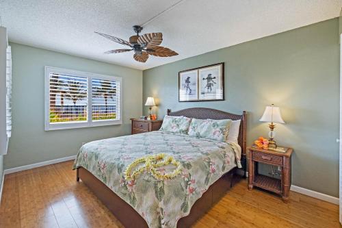 a bedroom with a bed and a ceiling fan at Maalaea Kai 110 Spectacular View in Paradise in Wailuku