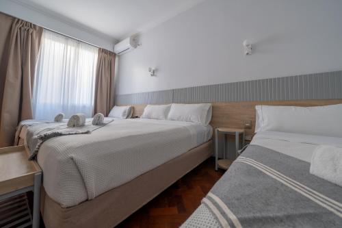 Postelja oz. postelje v sobi nastanitve HOTEL REGIS