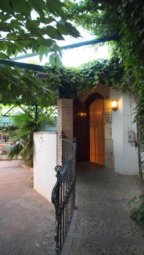 a entrance to a building with a wooden door at Hostal Miryam in L'Escala