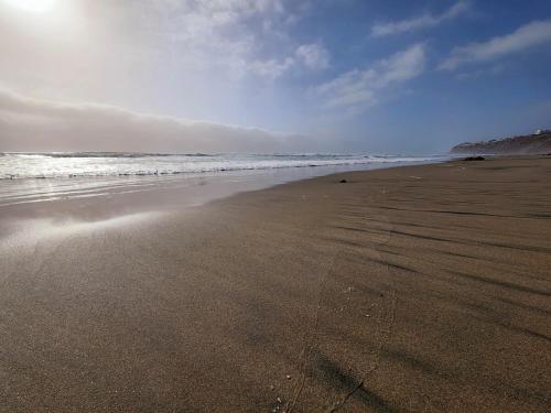 an empty beach with the ocean in the background at Baja Beach House Beautiful House Plaza del Mar in Primo Tapia