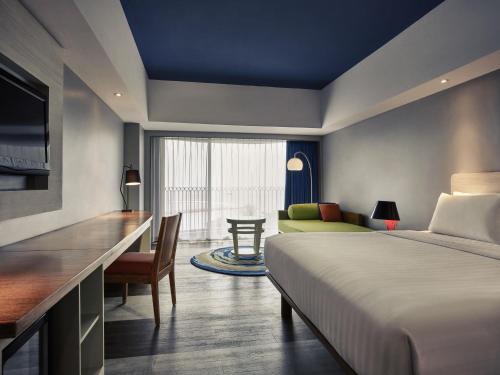 Ένα ή περισσότερα κρεβάτια σε δωμάτιο στο Mercure Convention Center Ancol
