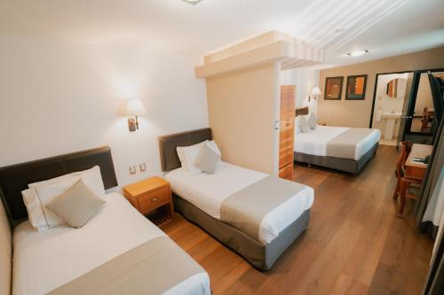 เตียงในห้องที่ Hotel Rio Tequisquiapan