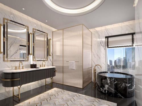 a bathroom with a tub and a sink at Sofitel New York in New York