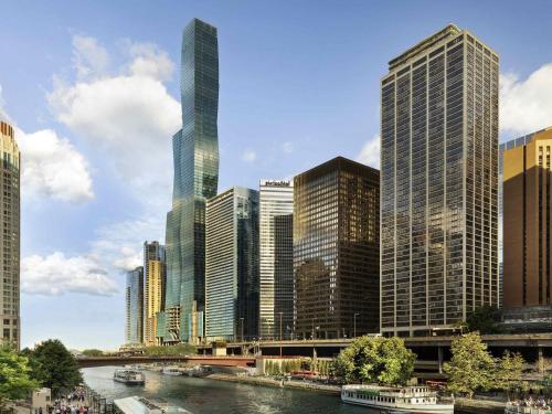 a city skyline with a river and tall buildings at Swissotel Chicago in Chicago