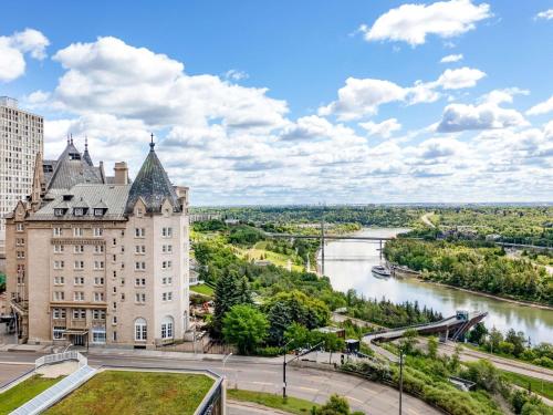 a view of a building and a river at Fairmont Hotel Macdonald in Edmonton