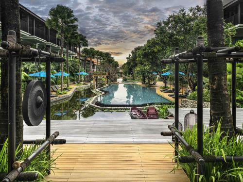 a view of a pool at a resort at Grand Mercure Khao Lak Bangsak in Khao Lak