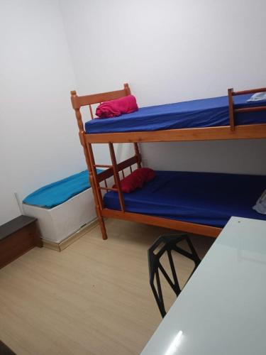 a room with two bunk beds in a room at Altitude Hostel in Porto Alegre