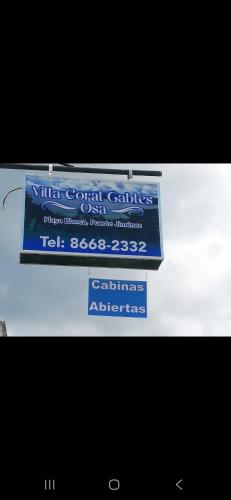 a sign for a virtual cornell college test base at Villa Coral Gables in Puerto Jiménez