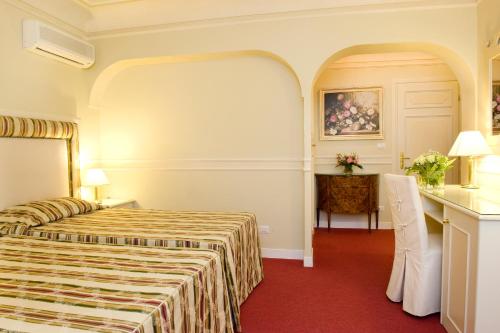 מיטה או מיטות בחדר ב-Park Hotel Villaferrata