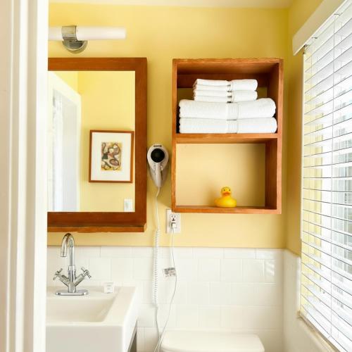 a bathroom with a sink and a mirror at Hotel Del Sol in San Francisco