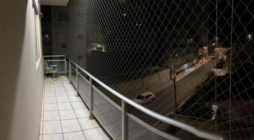 a bathroom with a fence on the side of a room at Apartamento praia do Gravata e prox Beto Carrero in Navegantes