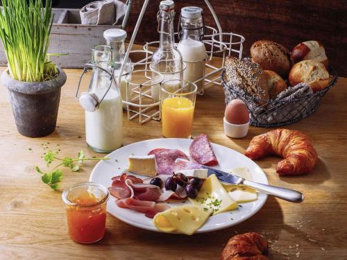 a table with a plate of food with bread and eggs at ibis Utrecht in Utrecht