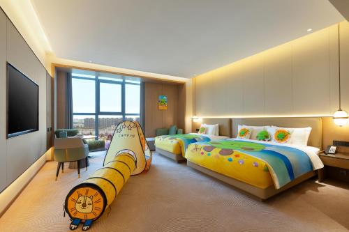 Ένα ή περισσότερα κρεβάτια σε δωμάτιο στο Wyndham Garden Shanghai Songjiang