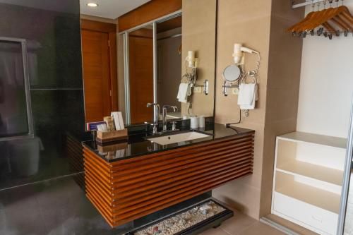 a bathroom with a sink and a mirror at Boracay Sands Hotel in Boracay