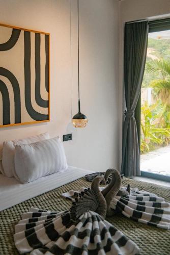 Giường trong phòng chung tại Villa India Kuta Lombok