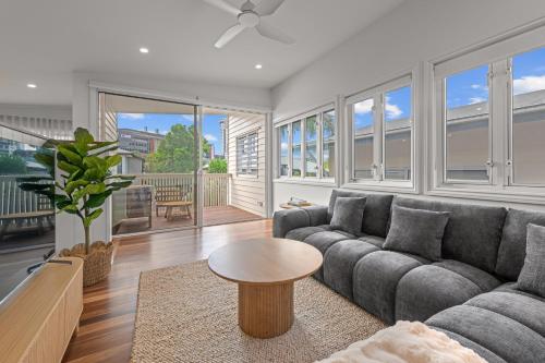 a living room with a couch and a table at The Coterie Fortitude Valley in Brisbane