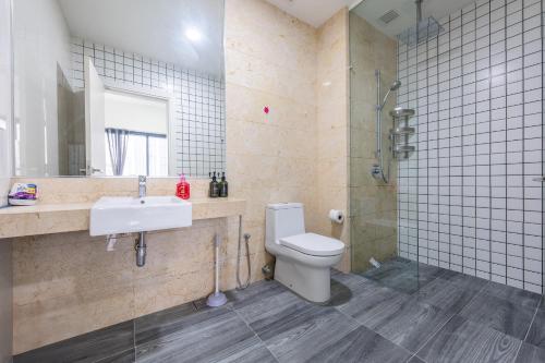 a bathroom with a toilet and a sink and a shower at MCity Ampang City view with infinity Pool in Kuala Lumpur