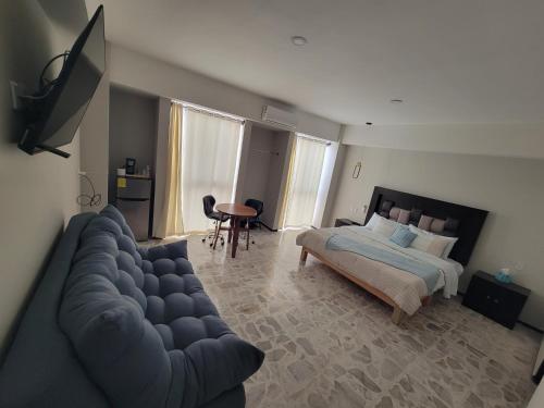 Postel nebo postele na pokoji v ubytování Suites & Lofts Olivier