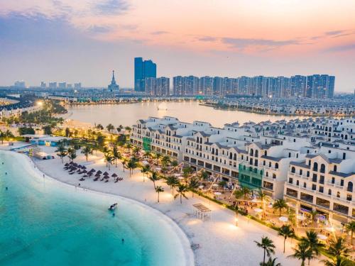an aerial view of a city with a beach and buildings at Bunnys Homes - Managed by WiWi - Vinhomes Ocean Park in Hanoi
