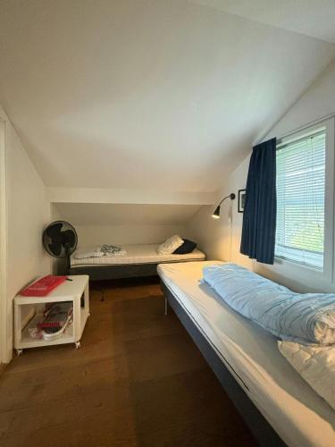 Postel nebo postele na pokoji v ubytování Modern Cabin With Panoramic Views In Aukland