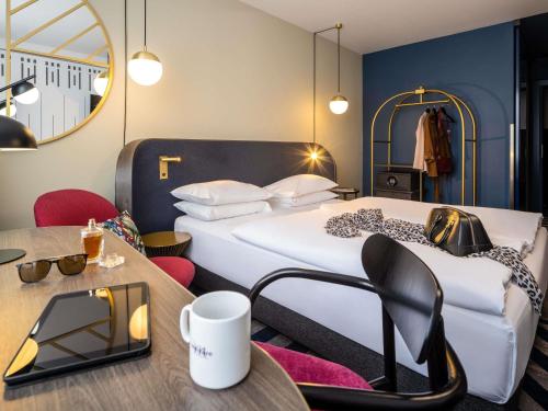 Uma área de estar em Hotel Mercure Wien City