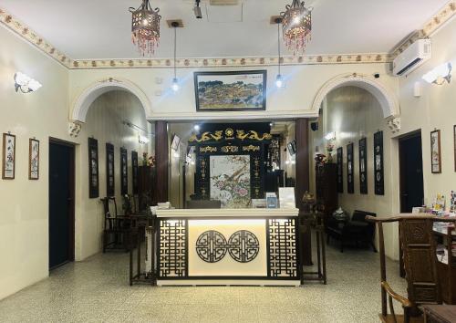 a room with a display in the middle of a building at The Century Hostel George Town 乔治市世纪青旅 in George Town