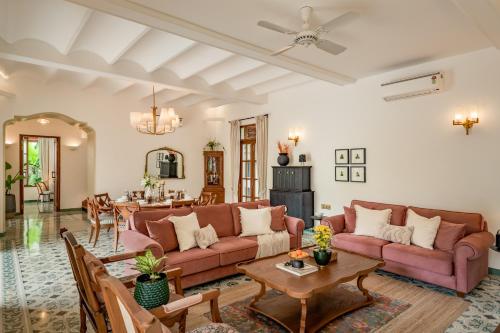 a living room with a couch and a table at La Dona by The Blue Kite - 4BHK Private Pool Villa in Assagao with Garden, Balcony, Caretaker & Spacious Living Area in Assagao