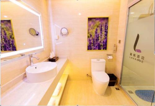 a bathroom with a sink and a toilet and a shower at Lavande Hotel Xuzhou Golden Eagle Shopping Centre in Xuzhou