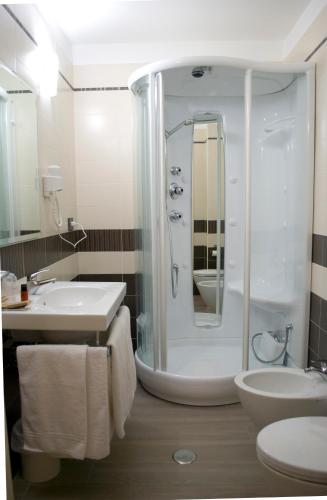 a bathroom with a shower and a sink at Galileo B&B in Rende